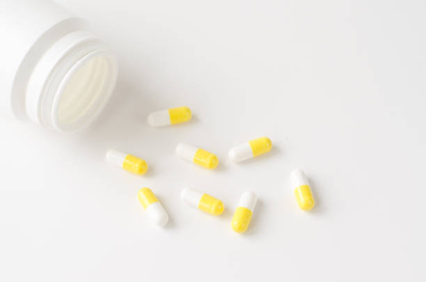 istock Pills spilling out of pill bottle 1206416179