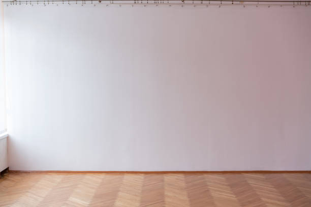 istock large white plastered wall in large hall 1206418602