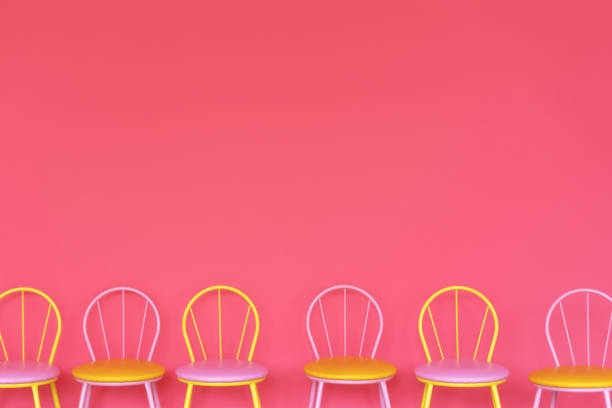 istock chairs stand in row along red wall 1206418735