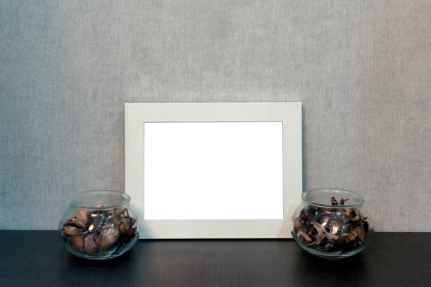 istock blank photo frame on shelf and vases with dry flower 1206418864