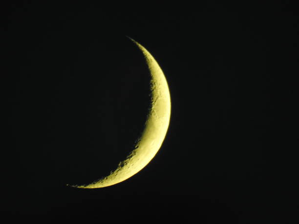 istock Narrow crescent moon on black sky at night 1206418993