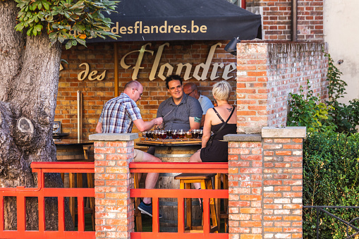 People at Beer Degustation in Bruges, Belgian. Bruges, Belgium - July 28 2018.