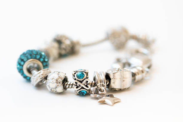 istock Beautiful bracelet with charms isolated on white background 1206421703