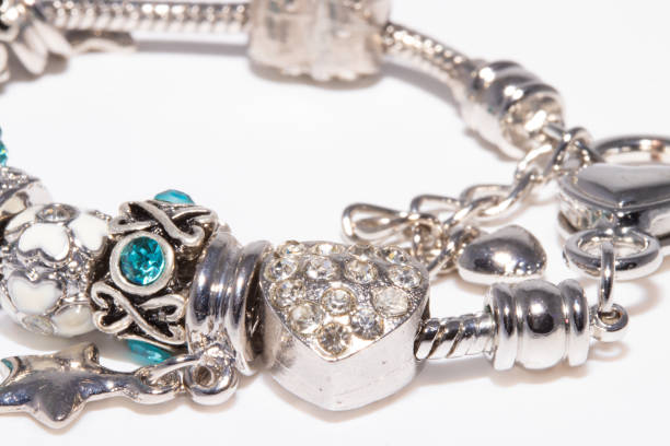 istock Beautiful bracelet with charms isolated on white background 1206421738