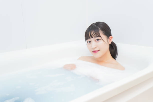 istock Young woman in the bath 1206423171