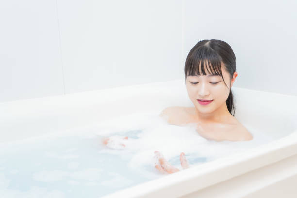 istock Young woman in the bath 1206423181