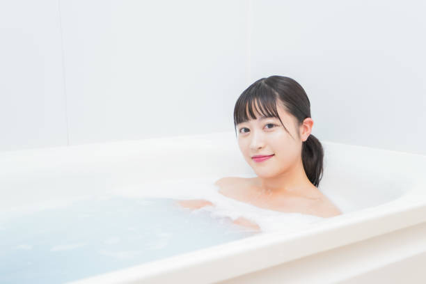 istock Young woman in the bath 1206423186