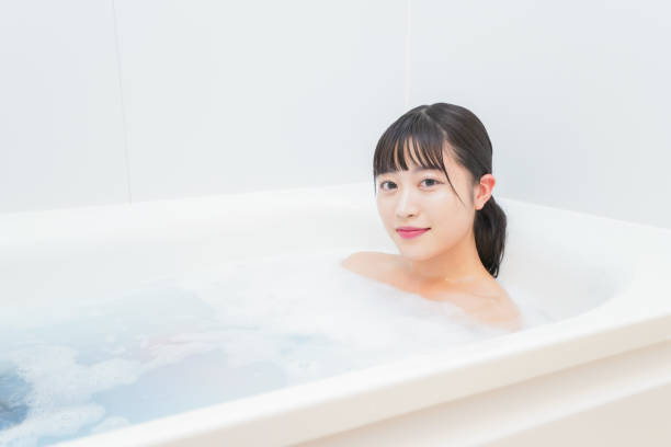 istock Young woman in the bath 1206423191