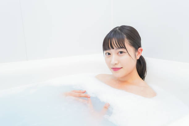 istock Young woman in the bath 1206423194
