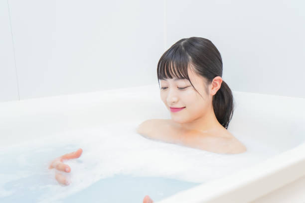 istock Young woman in the bath 1206423195