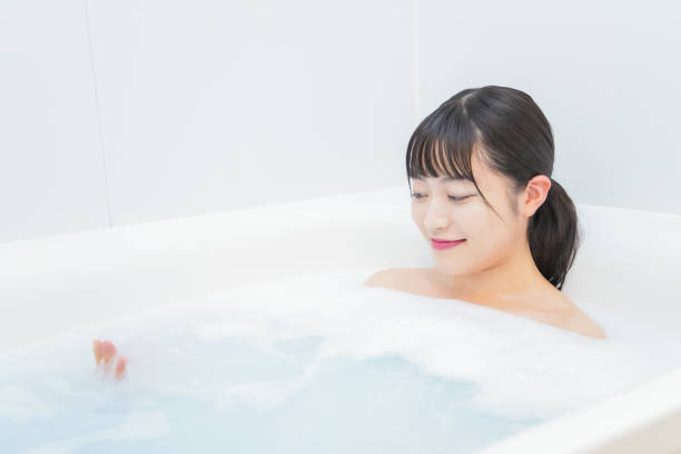 istock Young woman in the bath 1206423202