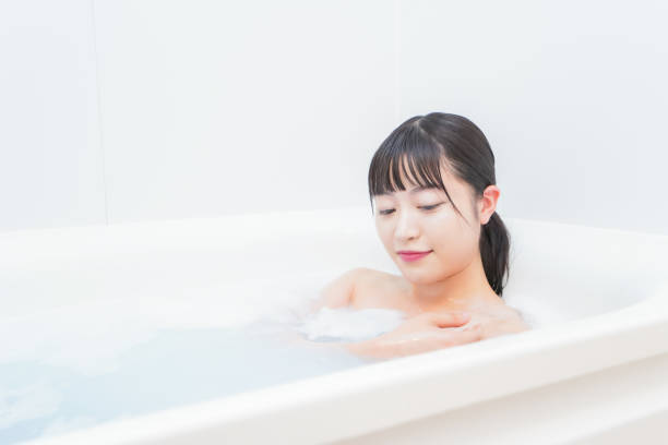 istock Young woman in the bath 1206423207