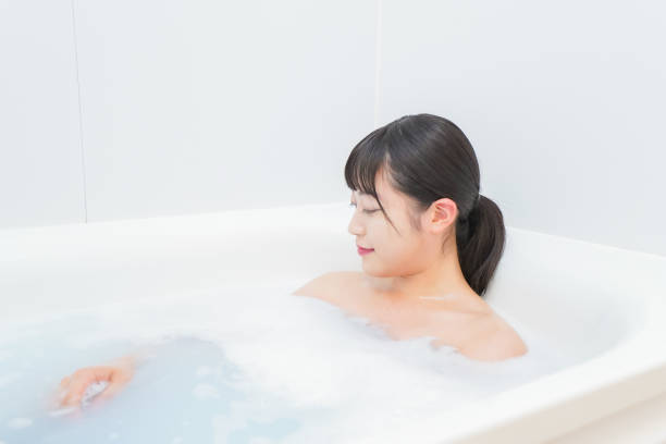 istock Young woman in the bath 1206423208