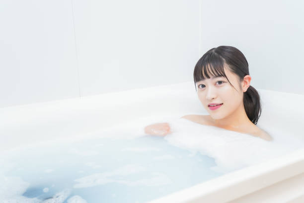 istock Young woman in the bath 1206423210