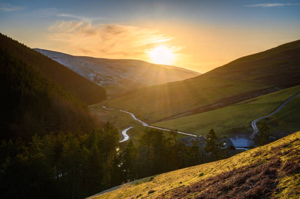 Sunset in the remote Upper Coquetdale Valley The remote Upper Coquetdale Valley, located in the Cheviot Hills close to the Scottish Border in Northumberland National Park pennines photos stock pictures, royalty-free photos & images