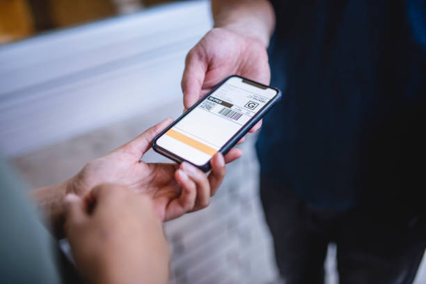 istock Delivery Driver Presenting Digital Device for Signature 1206427250