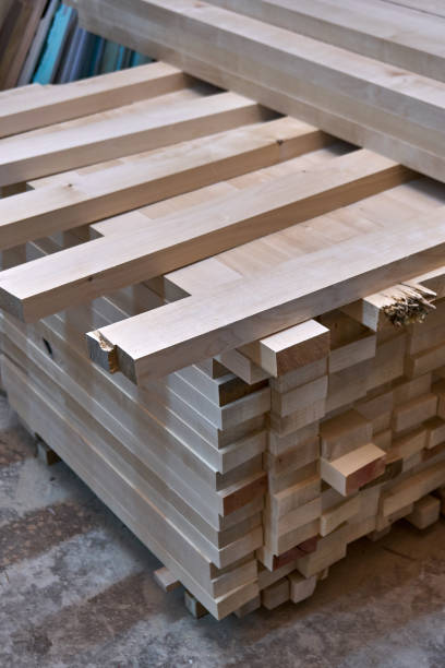 istock Wooden table legs. Stacked wooden table legs in workshop 1206427968