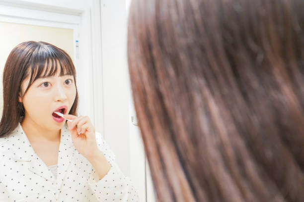 istock Young woman brushing before going to bed 1206427973