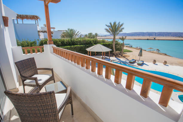 istock Terrace balcony with chairs in tropical luxury apartment 1206429811