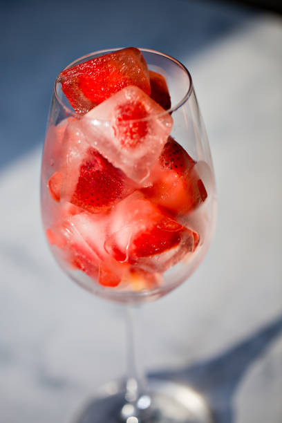 istock ice cubes with strawberries in a glass 1206433893