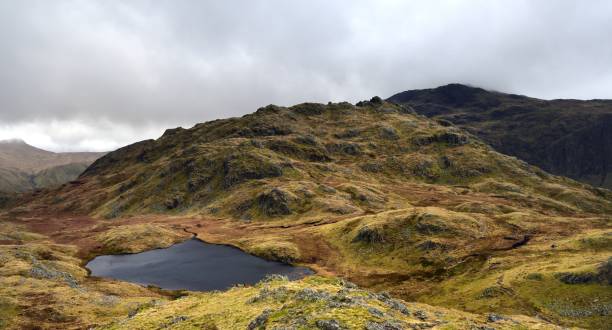 istock Glaramara appearing in a break in the low clouds 1206435104