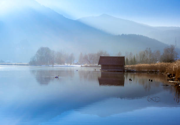 istock Boathouses on the Kochelsee, Bavaria, Germany 1206440580