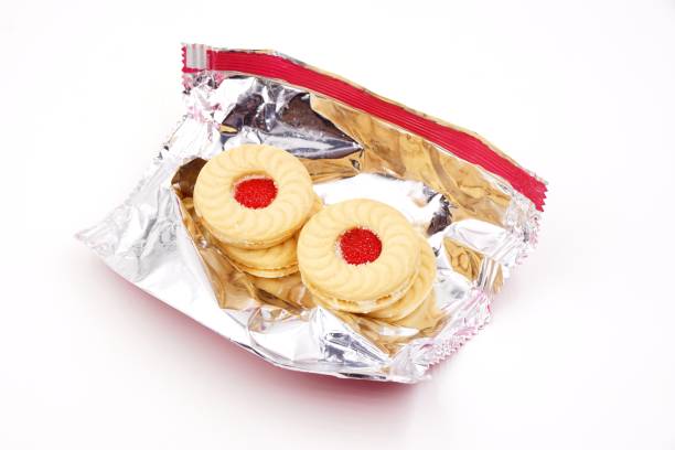Sandwich cookies with cream and strawberry jam