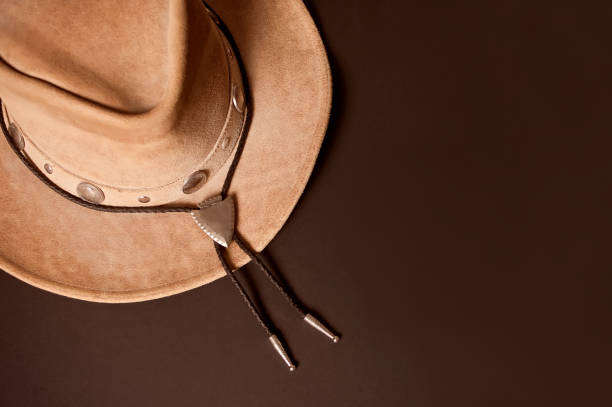 istock Brown cowboy hat on a brown background 1206443187