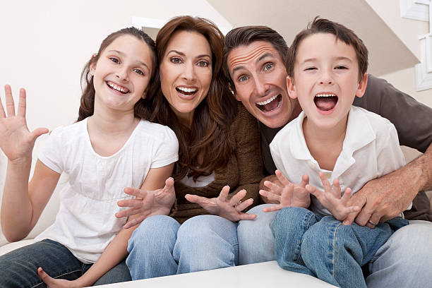 istock Happy Family Having Fun Sitting Laughing At Home 120644680