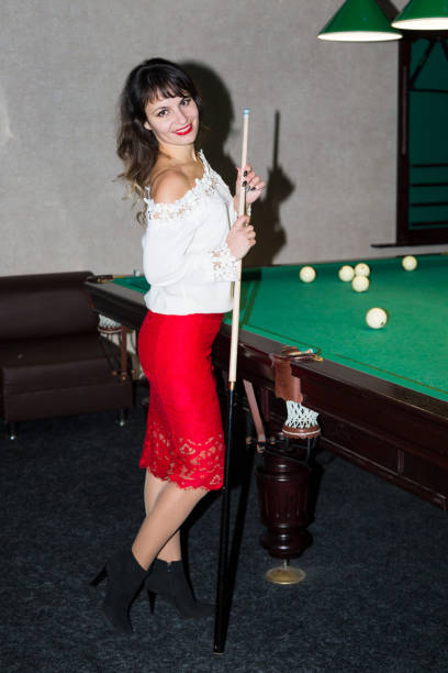 istock Brunette girl near the pool table. 1206447403
