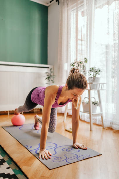 istock Fit Woman Doing Pilates Exercise At Home 1206448774