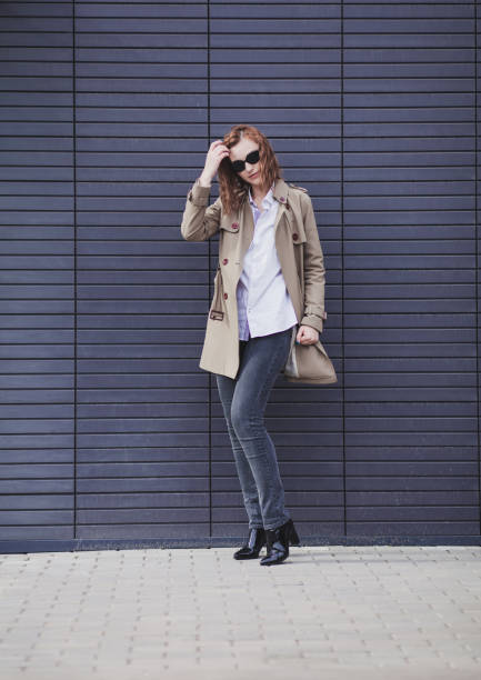 istock elegant beautiful woman in coat 1206448828