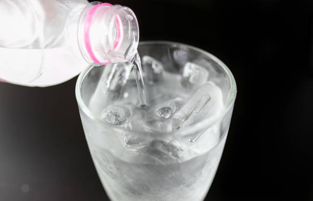 istock Cool water in glass on wooden table. 1206451899