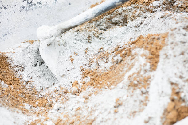 istock Worker labor, Mixer operator building staircase with concrete cement and brick at construction site. 1206452997