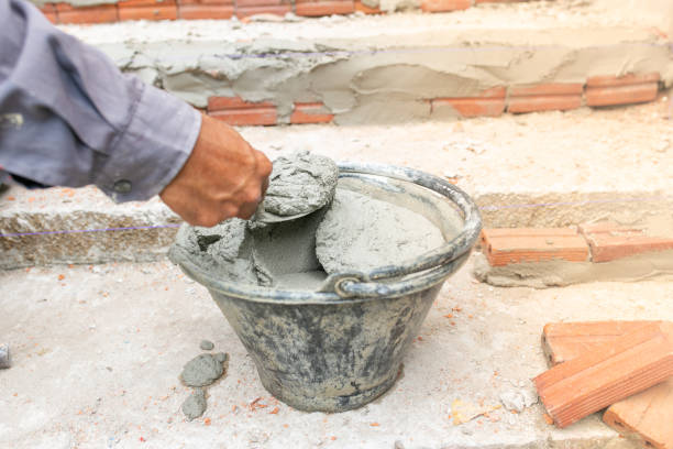 istock Worker labor, Mixer operator building staircase with concrete cement and brick at construction site. 1206453017