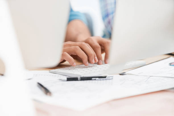 istock close up. background image of employees typing on the computer keyboard 1206453142