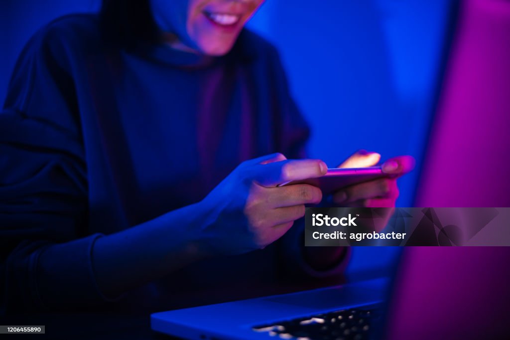 Woman play mobile game Leisure Games Stock Photo