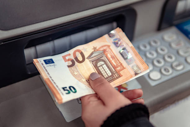 istock Euro cash withdrawals from ATM 1206458290