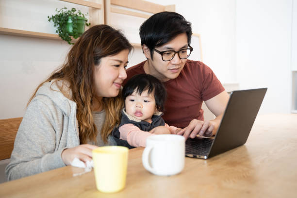 istock Family using laptop with baby boy 1206459608