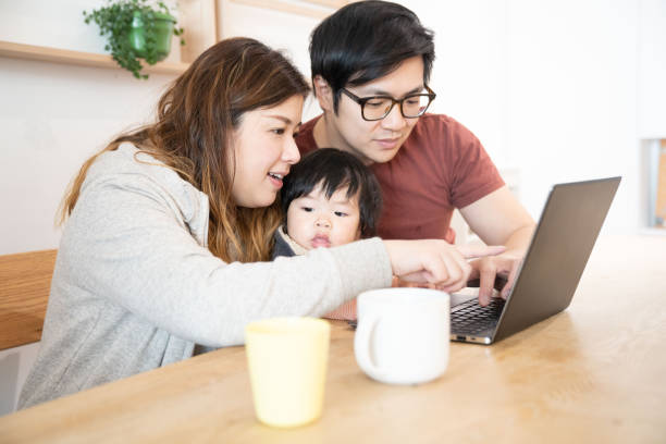 istock Family using laptop with baby boy 1206459650