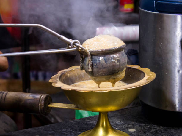 Hot Tandoori Tea/Chai Preparing and pouring Indian style Hot Tandoori Tea/Chai . Selective Focus is used. kolkata night stock pictures, royalty-free photos & images