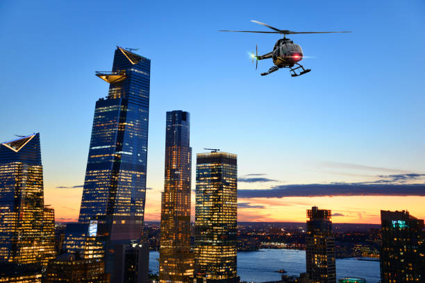 istock Helicopter flying over Manhattan at sunset 1206461685