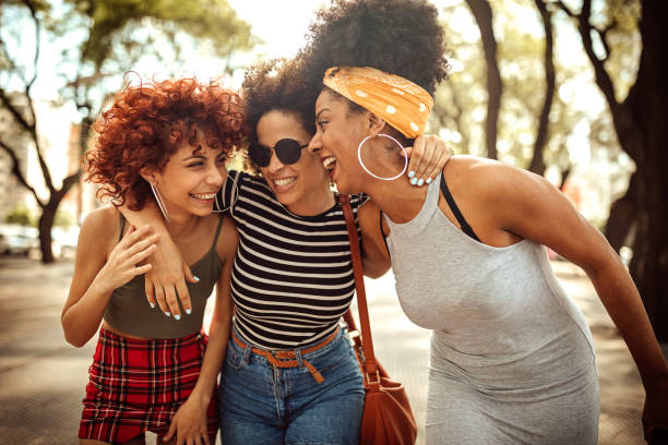 istock Female friends enjoying a walk and talk together during weekend 1206463162