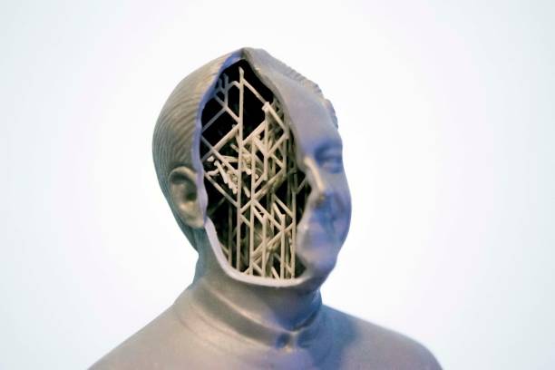 Example of printing a 3d object in the form of a human head with supports isolated on white background. Stereolithography 3D printer, photopolymerization UV light. Additive technology.
