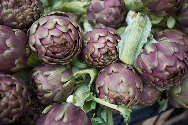 istock Raw artichokes sold in a market 1206468974