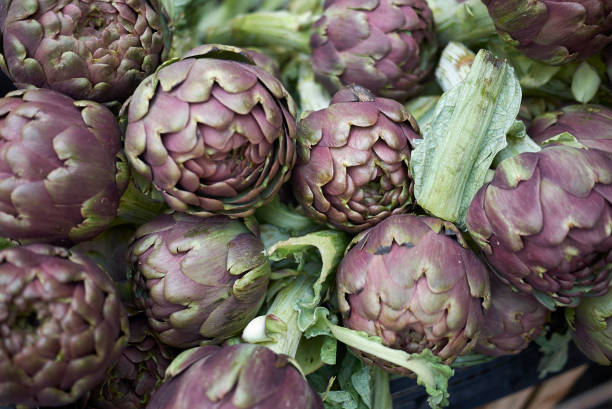 istock Raw artichokes sold in a market 1206468981