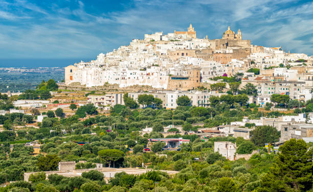 istock Panoramic sight in Ostuni on a sunny summer day, Apulia (Puglia), southern Italy. 1206473367