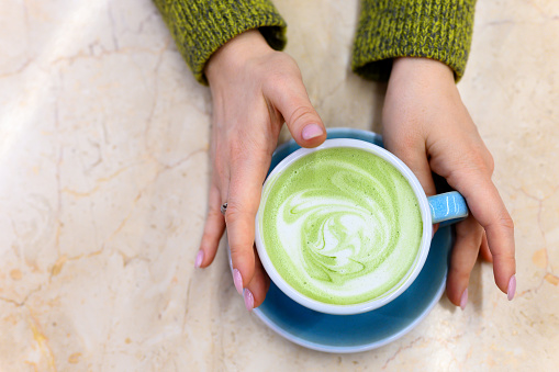 matcha, tea, latte, green, hands, amino acids, antioxidant, authentic, background, beautiful, blue, brew, bright, chlorophyll, concept, cup, day, drink, ecological, energy, female, flat lay, foam, food, good, gut, health, healthy, holding, hot, japanese, leaves, life, milk, mug, natural, nobody, object, pattern, powdered, pure, real, table, time, top view, trendy, vegan, vegetarian, woman, women