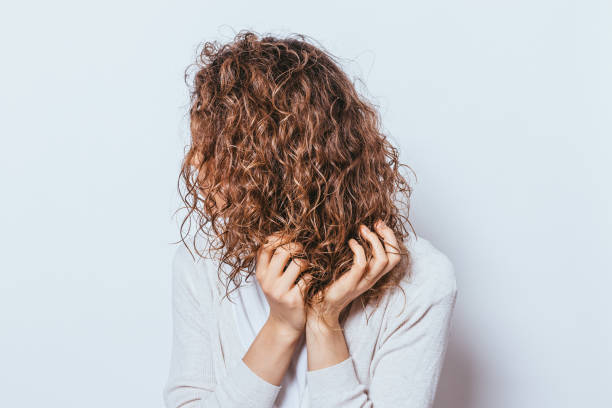 istock Unrecognizable young woman wearing white shirt applying with hands 1206479972