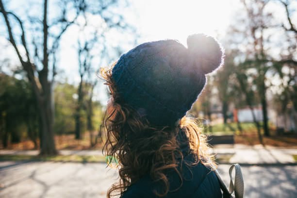 istock Rear view young woman wearing knitted hat 1206479992